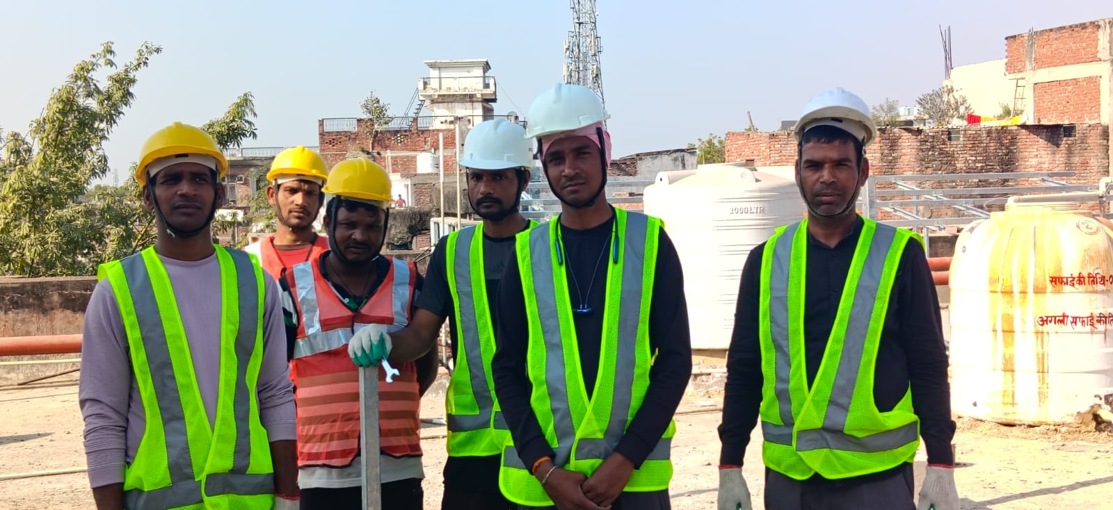 Safety-equipped installation team on site